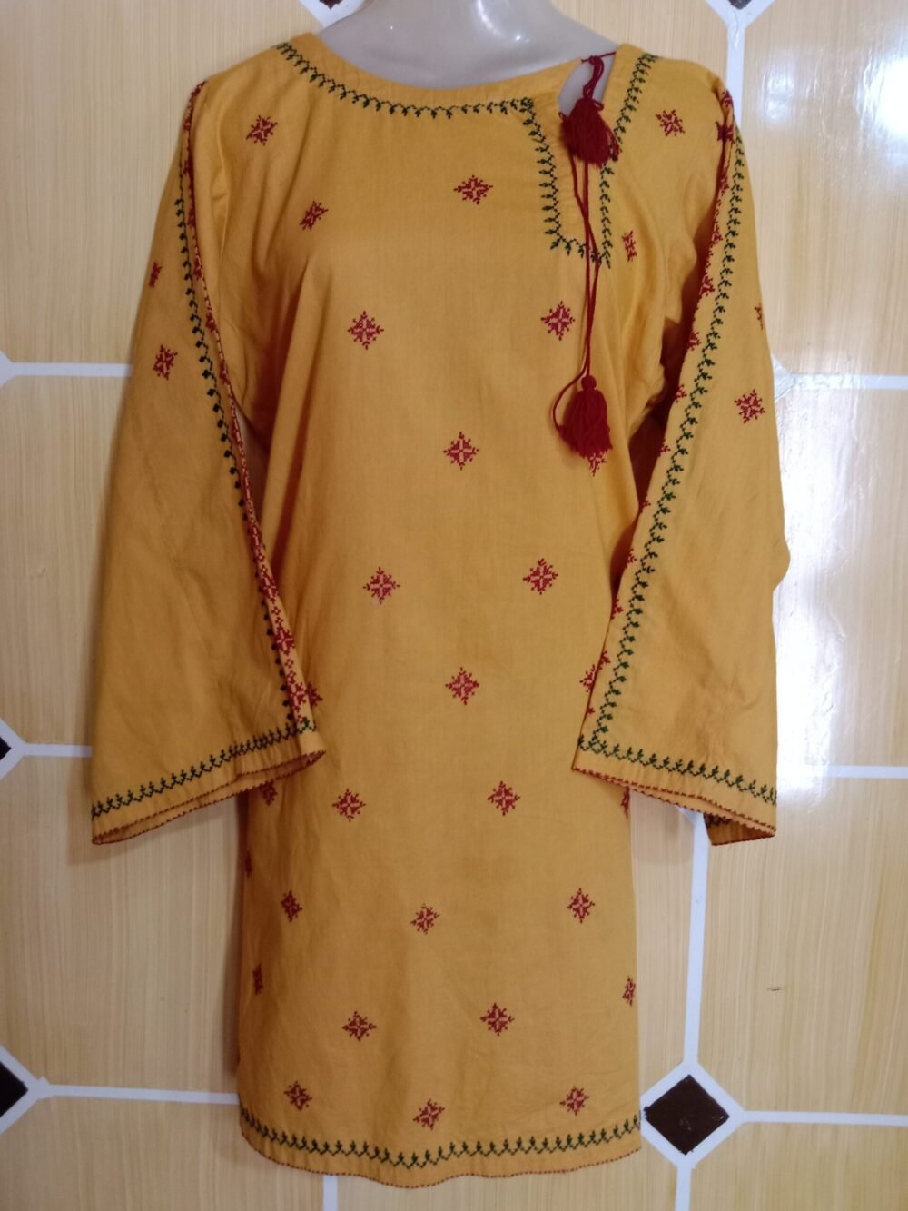 7 Amazing Benefits of Wearing a Cross Stitch Lawn Kurta-Orange